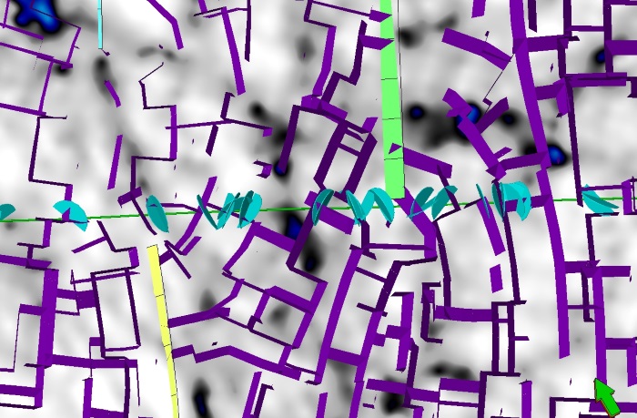 Comparison between our predicted fracture model (in purple) and the fractures observed on borehole images (light blue disks) in a well from the Kraka field.